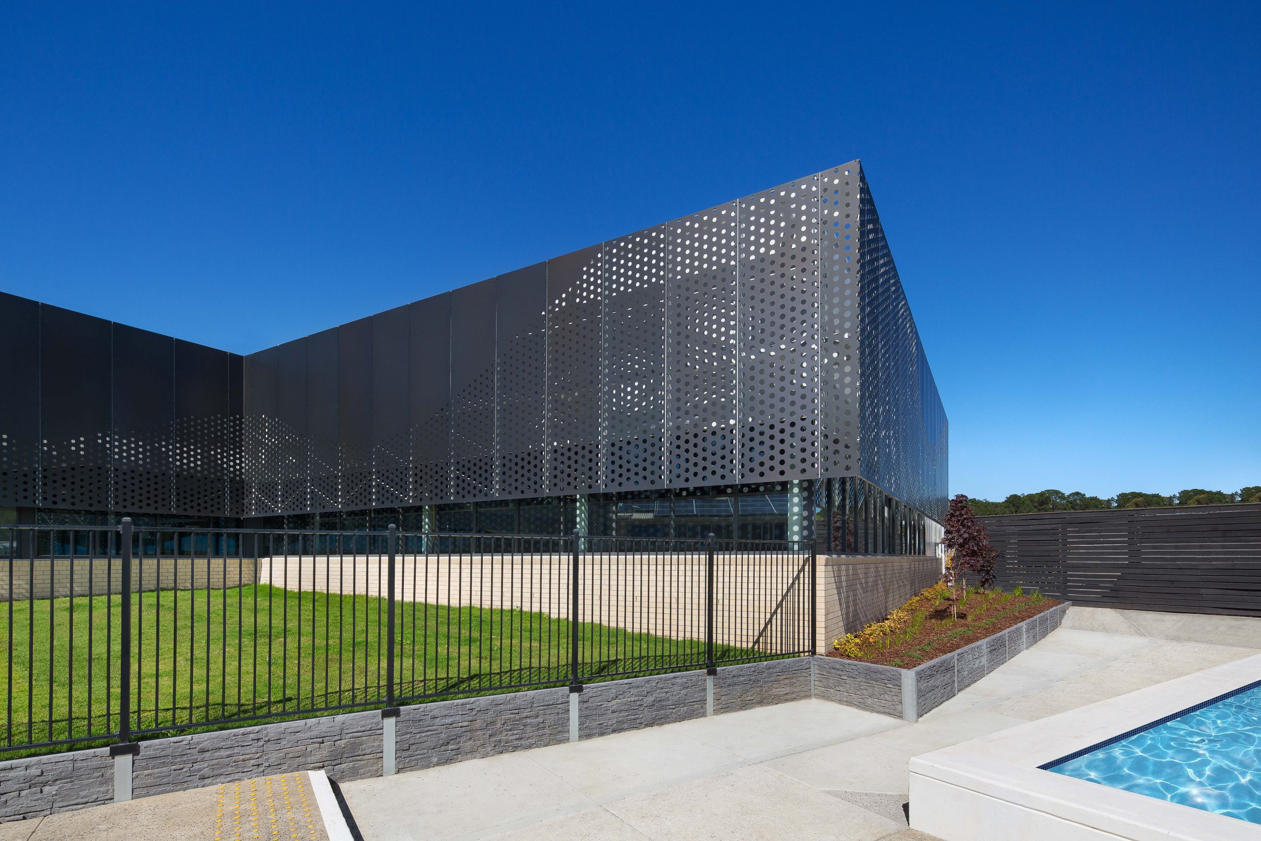 Perforated sheet metal facade by Arrow Metal - Bunburry Swimming Pool project