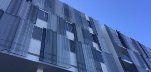 Perforated sheet by Arrow Metal - Infinity Apartments folded private screen panels